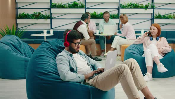 A Very Handsome Young Man is Doing Work on His alt