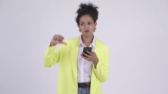 Happy Young Beautiful African Businesswoman Thinking While Using Phone alt