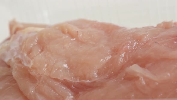 Fresh poultry meat 4K 2160p 30fps UltraHD  panning video - Raw chicken breasts in a box close-up slo alt