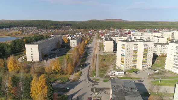 Aerial view of A provincial Russian city with low buildings. Autumn sunny day. 40 alt