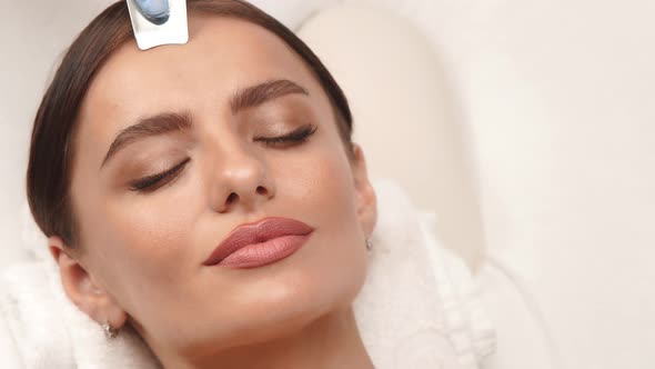 Beautiful Woman with Perfect Skin Having Face Massage alt