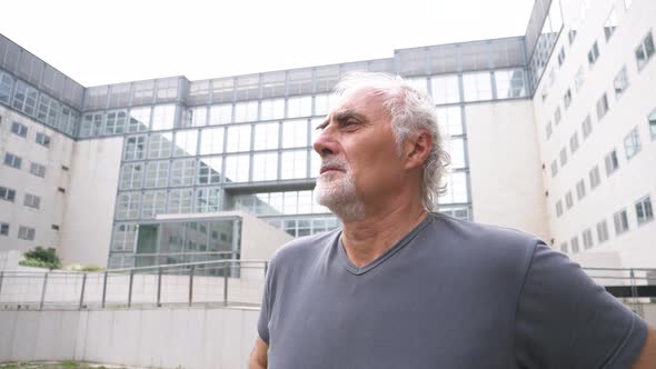 Slow motion shot of senior athletic man looking away alt