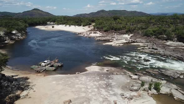 Aerial shot pulling back over an exotic South American rainforest landscape alt