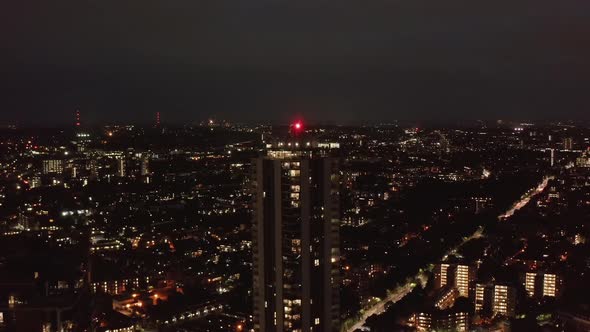 Forwards Fly Above Urban Neighbourhood at Night alt