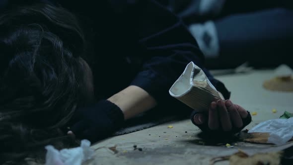 Homeless Woman Throwing Coins From Paper Cup, Begging for Alcohol and Drugs alt