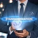 Businessman Smartphone Hologram Word   Standardization - VideoHive Item for Sale