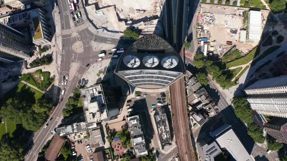 Fly Above Modern Strata Skyscraper with Three Wind Turbines Integrated to Building alt