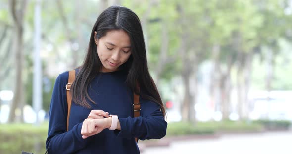 Woman use of smart watch alt