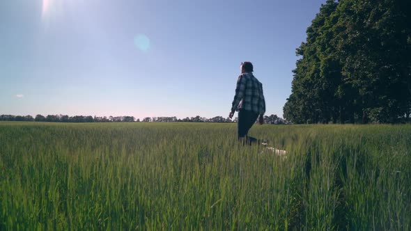 Caucasian Happy Man Running with Dog Outdoors alt
