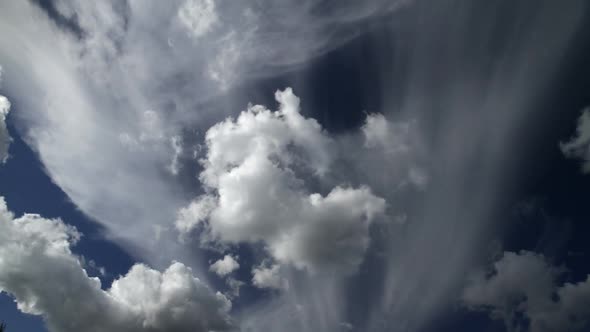 Cumulus clouds timelapse with blue sky.