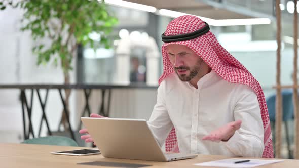 Loss, Arab Businessman Reacting To Failure on Laptop  alt