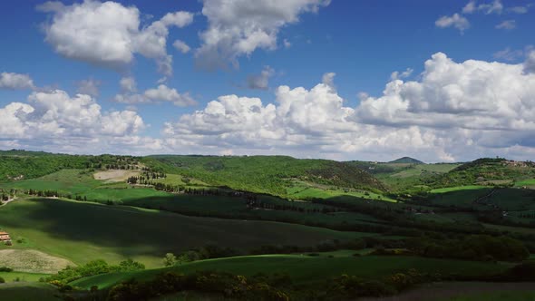 Shadows of Clouds Slide on Hills of Tuscany alt