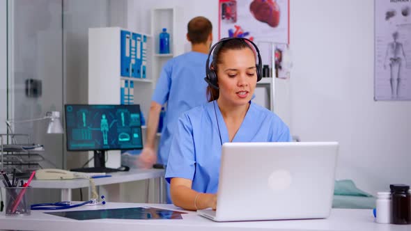 Medical Assistant Operator with Headphone Consulting Patients alt