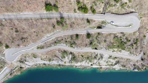 winding mountain road with very tight hairpin bends rises from the famous urnersee up a swiss mounta alt