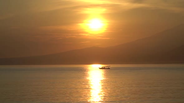 Golden Mystic Sunset on the Sea Coast with Mountains Horizon Line Tranquil and Calm Evening