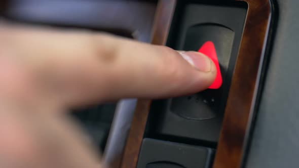 Male Hand Pressing Emergency Button in Auto, Stop by Roadside, Car Accident alt