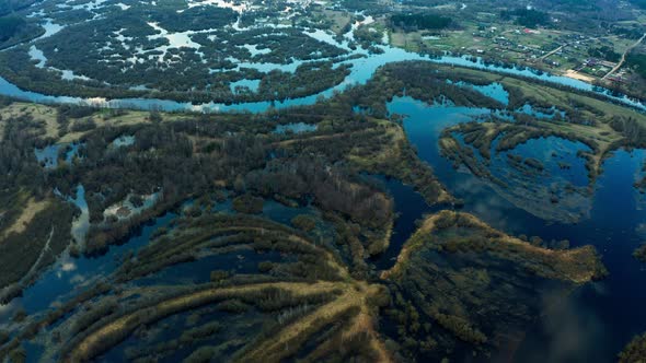 Spring flood, overflow of a large river from a bird's eye view.