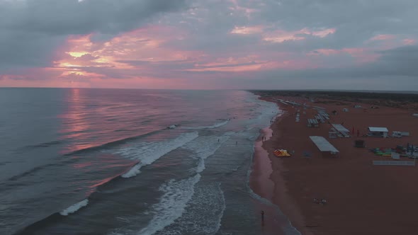 View From Above on the Long Beach and the Sea with a Beautiful Sunset alt