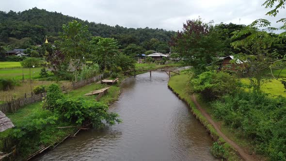 The river with beautiful mountains and nature view in countryside by drone