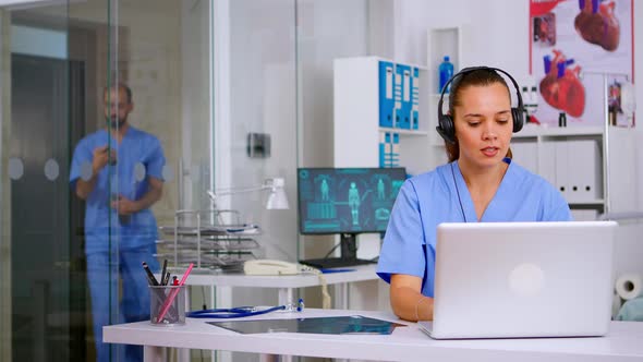 Specialist Health Practitioner Prescribing Treatments for Patients alt