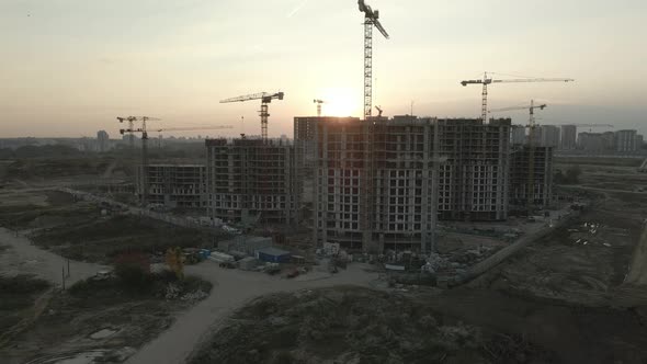 Construction site of a modern city block. High-rise buildings under construction. alt