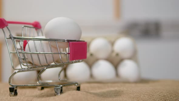 Fresh Store Bought Chicken Eggs In A Supermarket Trolley, Natural White Chicken Eggs alt