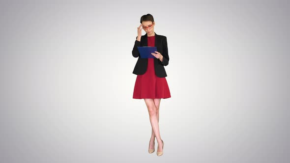 Young Beautiful Woman Reading Documents on Gradient Background. alt