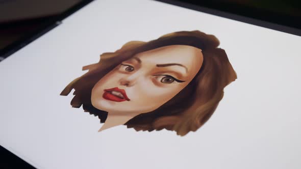 Close up of a digital pen drawing artwork on a graphic tablet