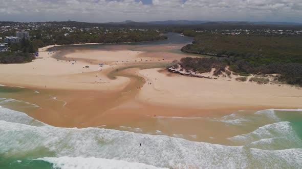 Aerial drone view of beach at Currimundi Lake, Caloundra, Sunshine Coast, Queensland, Australia alt