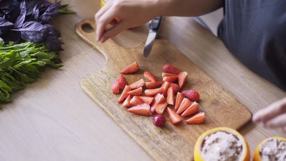 Female Cook Cuts Red Strawberry