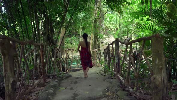 Cute Asian Girl Walking on a Bridge in Hot Spring in Slow Motion Thailand
