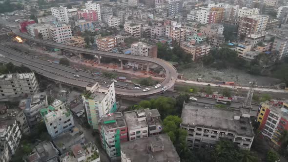 Aerial birdseye view over the tower block apartments and infrastructure of Khilgaon suburb of Dhaka. alt