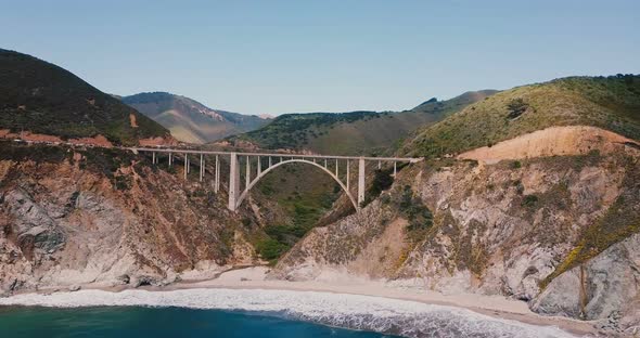 Drone Flying Towards Iconic Bixby Creek Bridge at Highway 1 in Big Sur USA, Amazing Cinematic alt