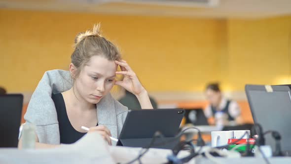 Woman Designer Using Graphic Tablet in Open Space Coworking Office Irrl alt