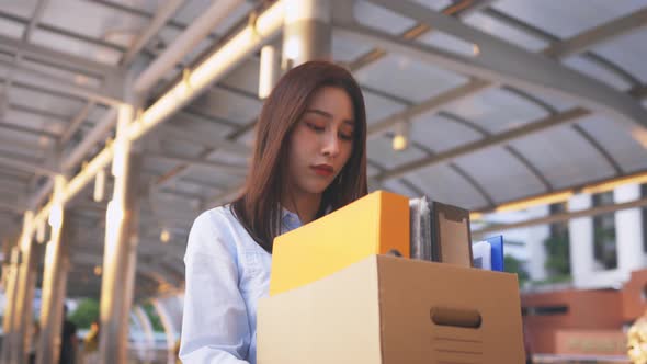 Woman Fired From Job Holding Box of Items alt