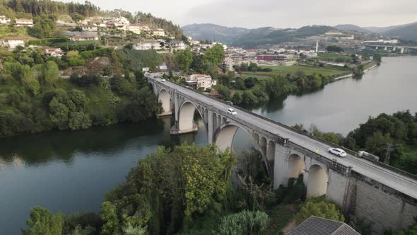 Aerial parallax motion, over scenic bridge, Entre-os-rios, Douro valley - Portugal