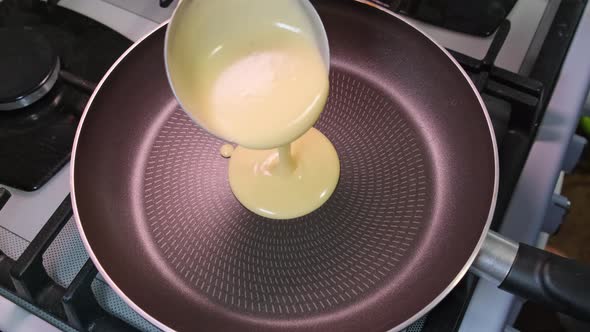 Close Up Slow Motion Pouring Pancake Mixture Frying Pan Homemade Breakfast