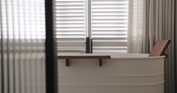 Transparent Sliding Door Closed Inside the Modern Bathroom Minimalist Bathtub alt