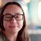Closeup Portrait of a Beautiful Adult Woman with Glasses Looking Calmly Thoughtfully at the Camera - VideoHive Item for Sale