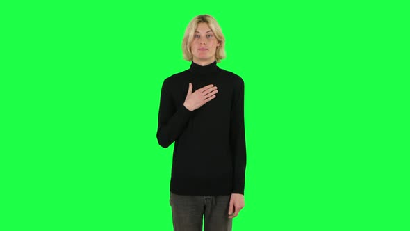 Blonde Guy Indignantly Talking To Someone, Looking at the Camera. Green Screen alt