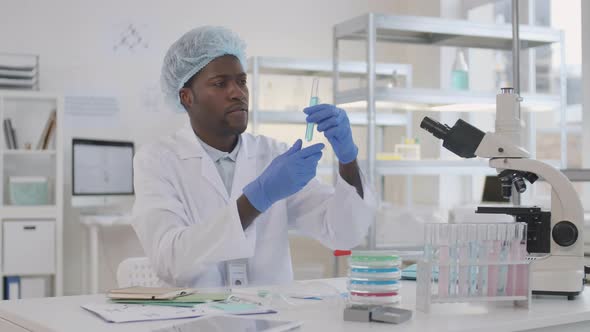 African Scientist Working in Lab alt