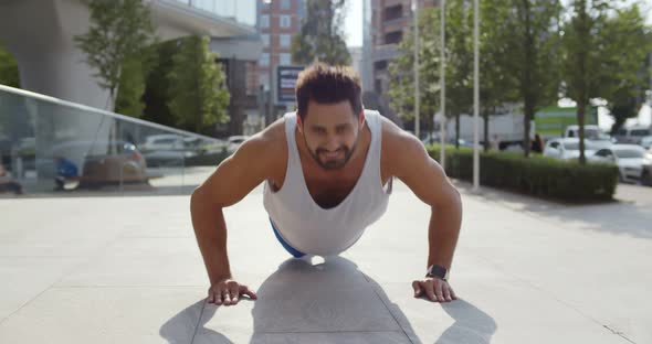 Indian Man Doing Workout Exercise Outdoors in City alt