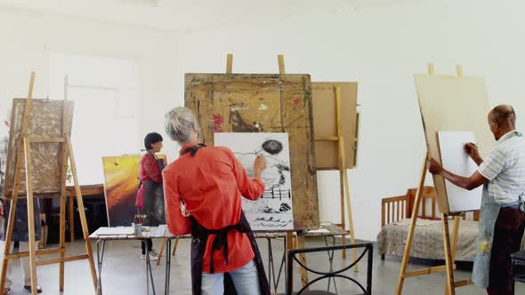 Artist drawing sketch on canvas alt