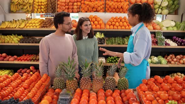 Grocery Store Staff Choosing Pineapple for Buyers alt