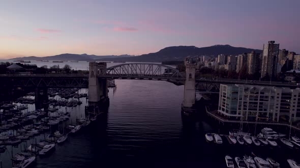 Drone flying over Burrard Bridge at sunset, Vancouver in Canada. Aerial drone panoramic view alt