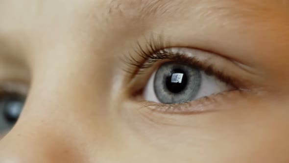 Eye of Kid Looking at Tablet, Stock Footage | VideoHive