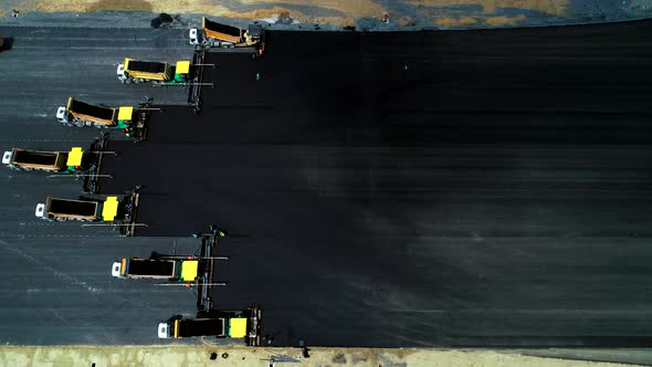 Road Construction Applying New Hot Asphalt alt