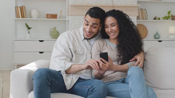 Hispanic Family Couple Married Spouses Spaniard Man and Young Woman Hugging Embracing Cuddling Use alt