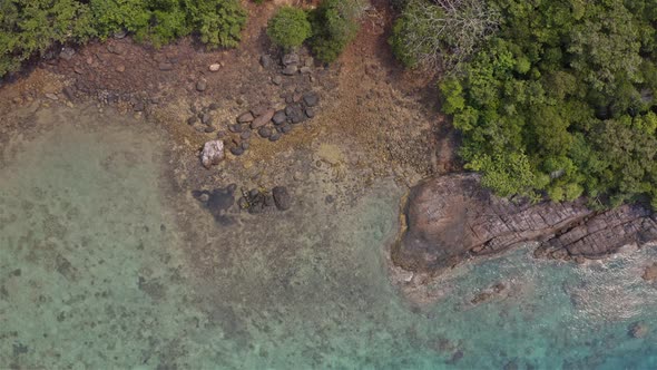 Pan out view of the rocky beach in Tenggol Island