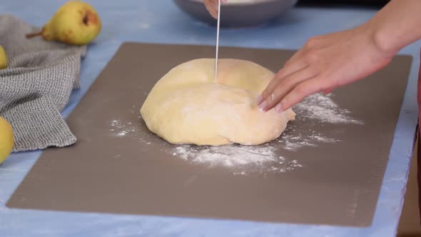 Cutting Dough to Shape It for Bread Baking